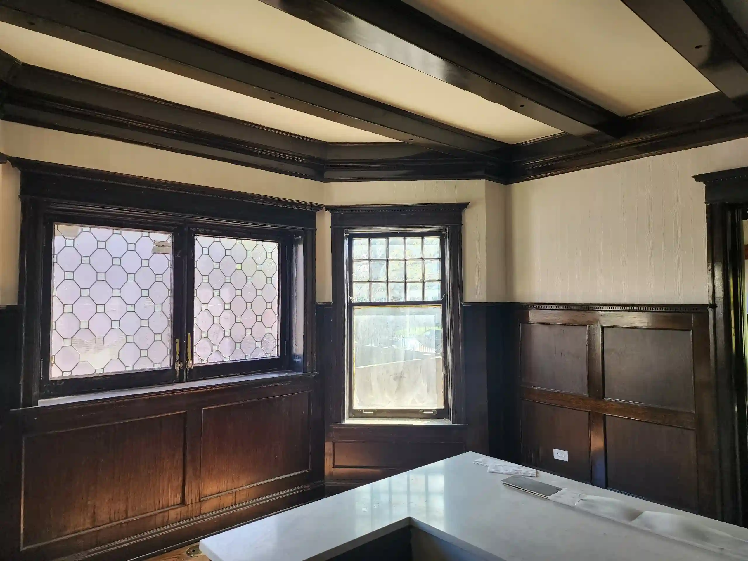 Before and after wallpaper removal showing clean wall surface